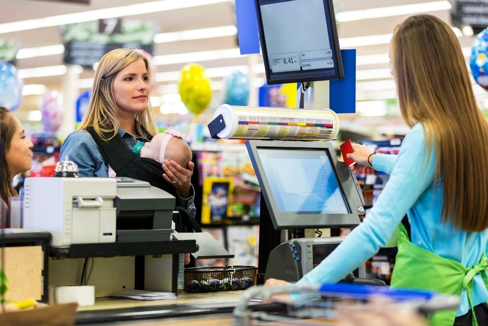 mom in line at the store cashier