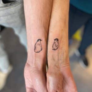 Mother and son tattoos