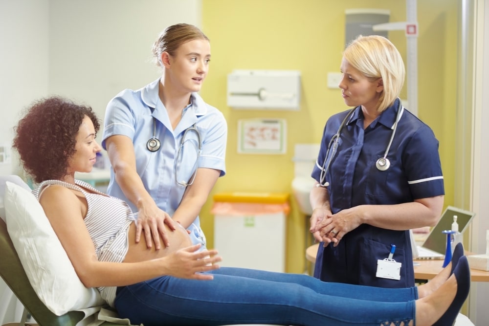 pregnant and midwife with nurse