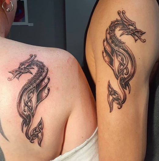 Matching dragon tattoos